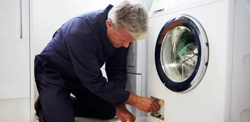 man-fixing-washer